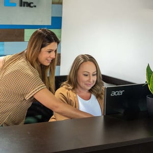 Laura and Tessa front desk